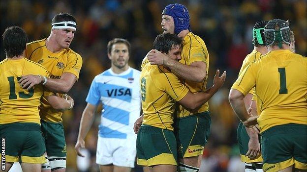 Australia's Nathan Sharpe and Nick Phipps celebrate