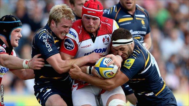 Gloucester's Ben Morgan is tackled by Worcester duo Joe Carlisle and Sam Betty