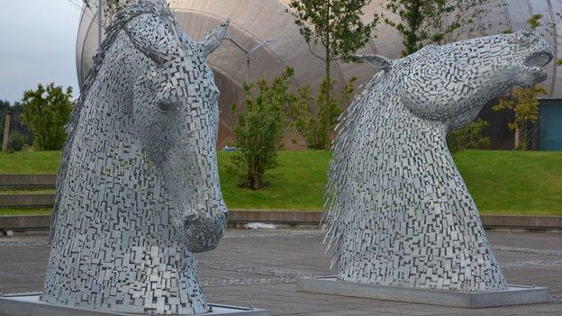 A small-scale replica of The Kelpies has been on display outside the BBC in Glasgow