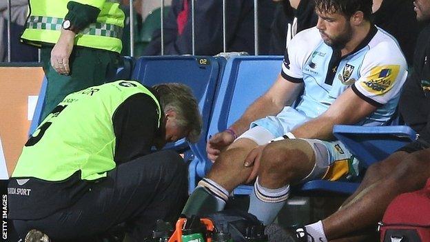 Ben Foden receives treatment after suffering an ankle injury