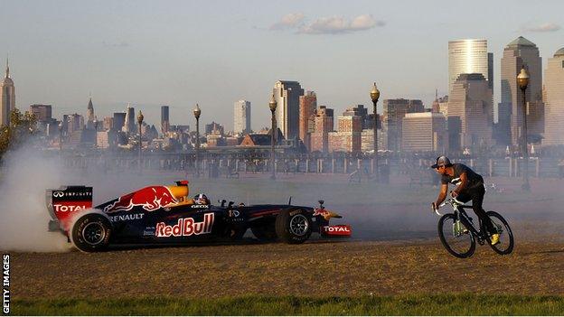 Former Red Bull Racing Formula 1 driver David Coulthard drives the Red Bull running show car through Liberty State Park in New Jersey