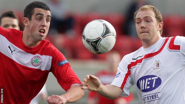 Joe Gormley of Cliftonville in action against Portadown's Ross Redman