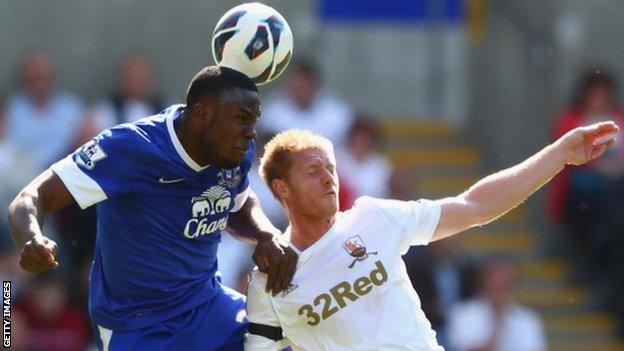 Alan Tate is beaten in the air by Everton's Victor Anichebe