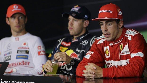 Jenson Button (left) and Fernando Alonso (right) and Sebastian Vettel (middle)