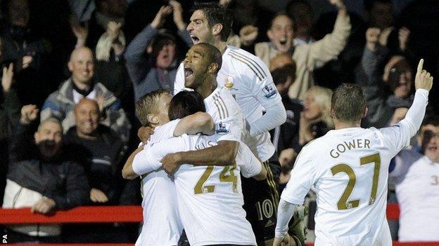 Swansea players mob match-winner Garry Monk