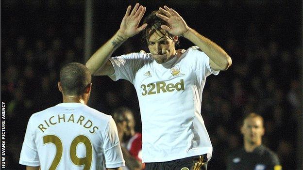 Miguel Michu celebrates Swansea's opener