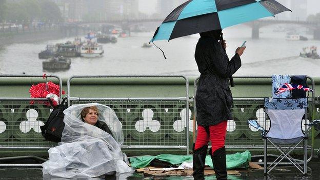 Rain-drenched revellers