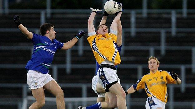 St Gall's player Niall O'Neill challenges Patrick McBride for the high ball in the final