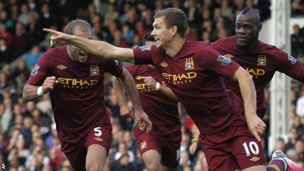 Edin Dzeko celebrates after scoring Manchester City's winner