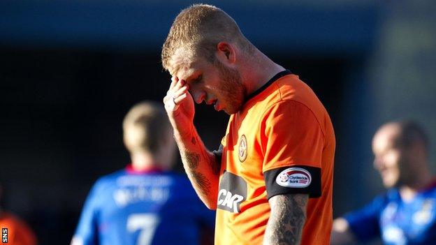 Dundee United striker Johnny Russell looks distraught at Caledonian Stadium