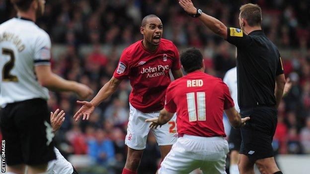 Dexter Blackstock pleads his innocence to referee Robert Madley