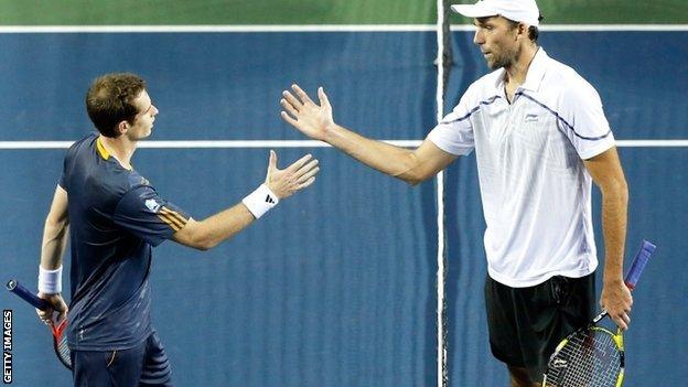 Andy Murray (left) defeats Ivo Karlovic in Japan