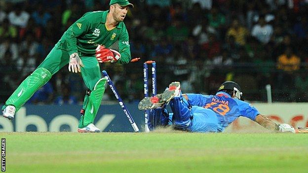 Suresh Raina dives to make his ground