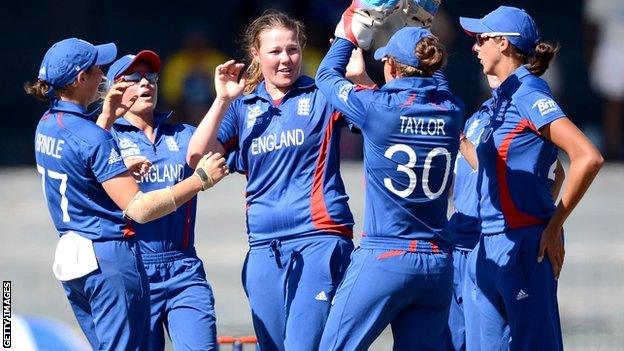 Anya Shrubsole celebrates with her England teammates