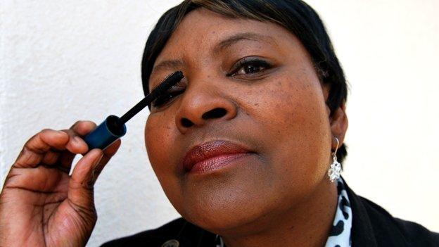 Maggy More applying Avon mascara