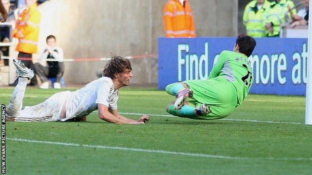 Miguel Michu heads home Swansea's opening goal