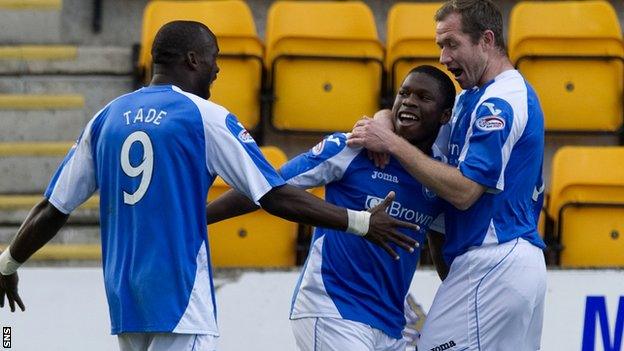 Gregory Tade congratulates goalscorer Nigel Hasselbaink