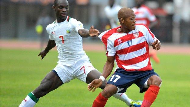 Gebro Georges (right) in action for Liberia.