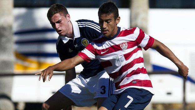 Scotland's Clark Robertson closes down American goalscorer Jose Villarreal