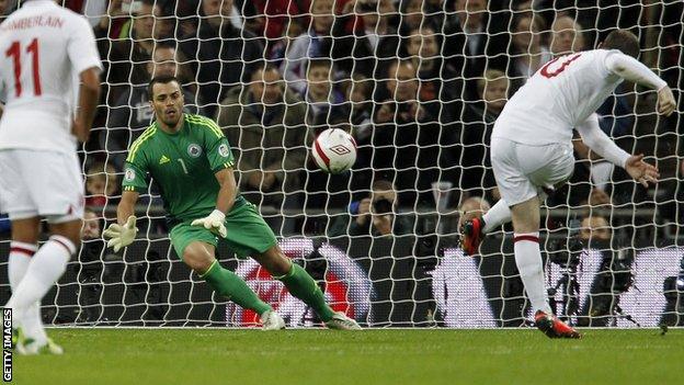 Wayne Rooney smashes in England's opener from the penalty spot