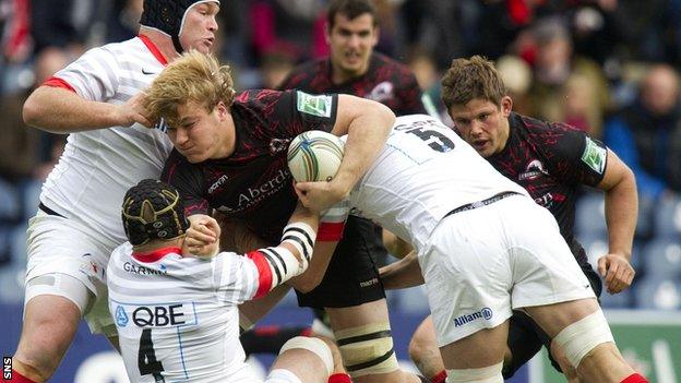 David Denton (centre) is closed down by Saracens' Matt Stevens, Steve Borthwick (4) and Mouritz Botha