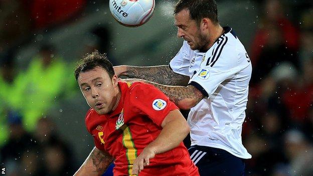 Darcy Blake in action against Scotland's Steven Fletcher