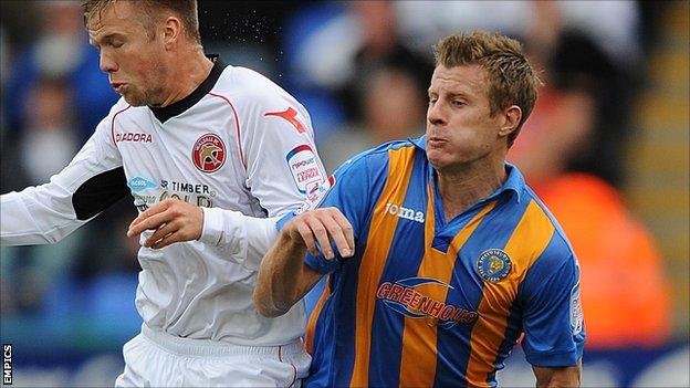 Walsall's Nicky Featherstone and Shrewsbury Town"s Paul Parry