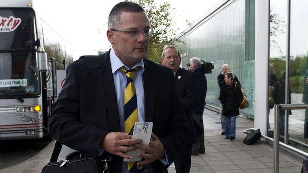 Craig Levein arrives at Bristol Airport as Scotland leave for Belgium