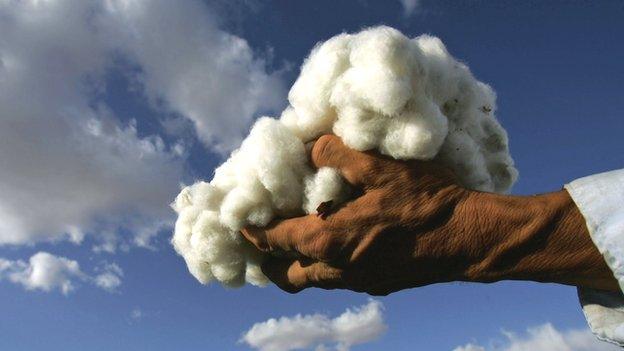 A man holding some cotton