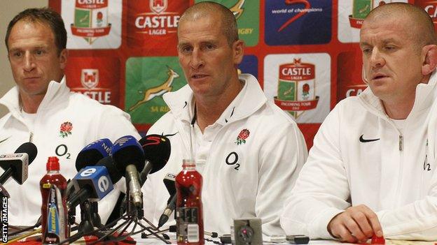 Stuart Lancaster (centre) is flanked by assistant coaches Mike Catt (left) and Garaham Rowntree (right) after England's third Test against South Africa