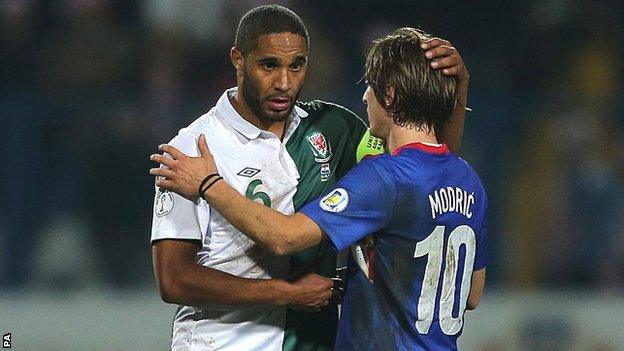 Wales captain Ashley Williams (left) is consoled by Croatia's Luka Modric