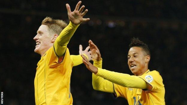 Rasmus Elm celebrates with his team mate Tobias Sana after scoring Sweden's late equaliser