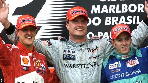 David Coulthard (centre) celebrates one of his 13 grands prix victories