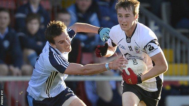 Mayobridge player Kevin McClorey in action against Kilcoo opponent Paul Devlin at Pairc Esler