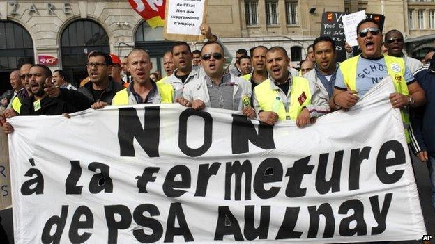 PSA Peugeot Citroen workers in street protest against planned job cuts and factory closure