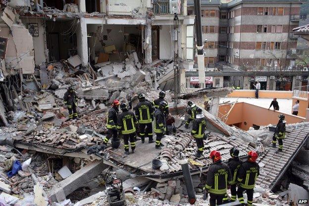 Rescue workers in collapsed building