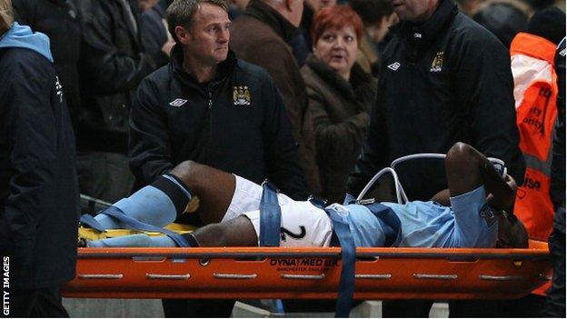 Micah Richards is carried off on a stretcher