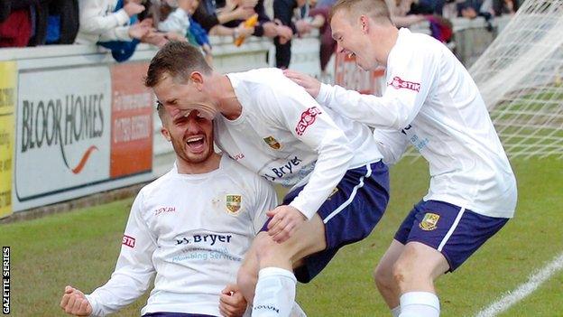 Tom Knighton celebrates scoring for Yate Town with Scott Thomas and Matt Groves