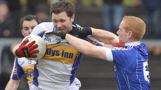 Errigal Ciaran's Enda McGinley is challenged by Conor Nevin in the quarter-final