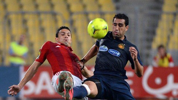 Al-Ahly player Mohamed Nagui (left) vies for the ball with Sameh Derbali of Esperance