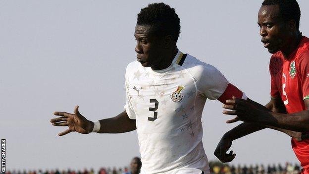 Ghana captain Asamoah Gyan (left)