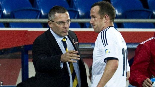 Levein talks to Adam on the touchline