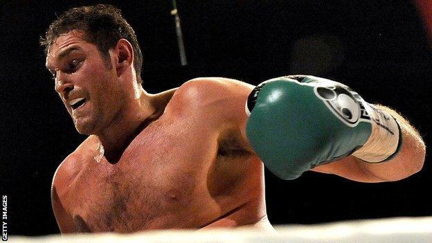 Tyson Fury throws a punch