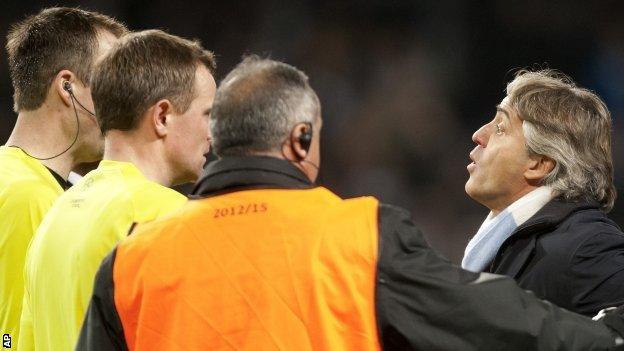 Manchester City boss Roberto Mancini remonstrates with officials at the final whistle