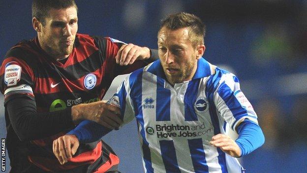 Stephen Dobbie (right) is challenged by Gabriel Zakuani