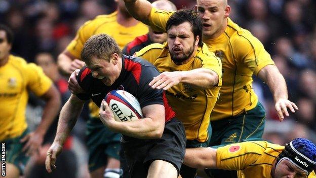 Chris Ashton of England evades Australian tackles