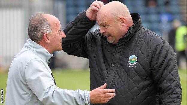 Cliftonville manager Tommy Breslin and David Jeffrey of Linfield