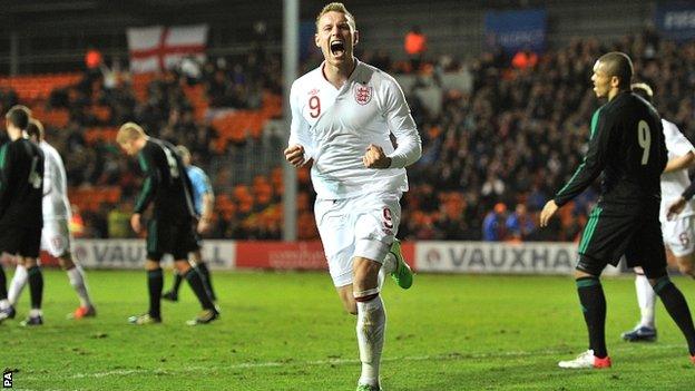 Connor Wickham celebrates scoring for England-U21s against Northern Ireland.