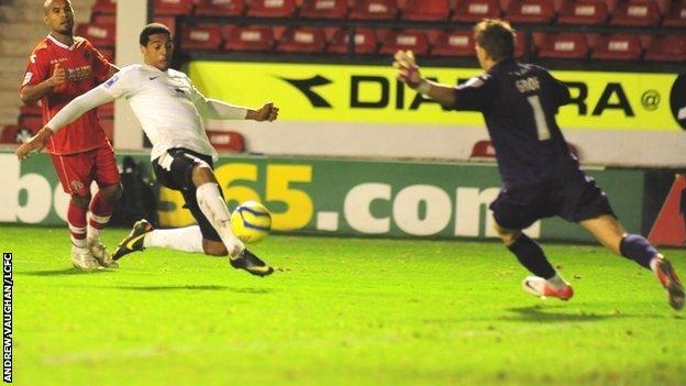 Vadaine Oliver scores for Lincoln against Walsall