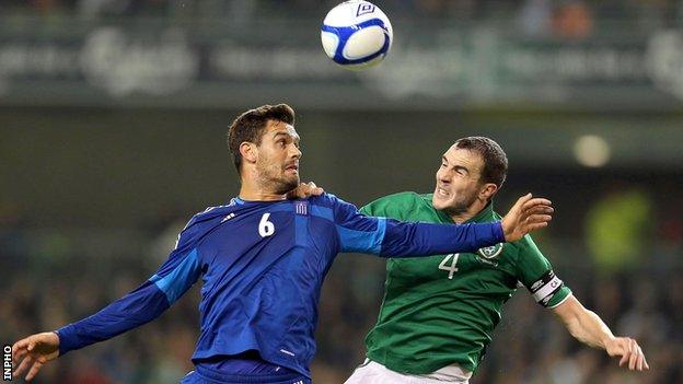 John O'Shea battles with Alexandros Tziolis at the Aviva Stadium